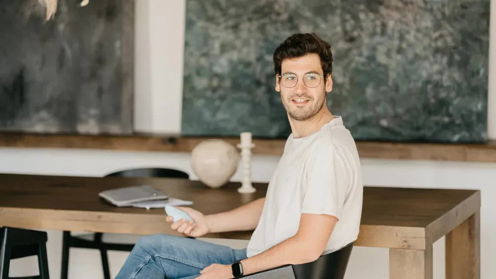 man sits at desk and does breathwork