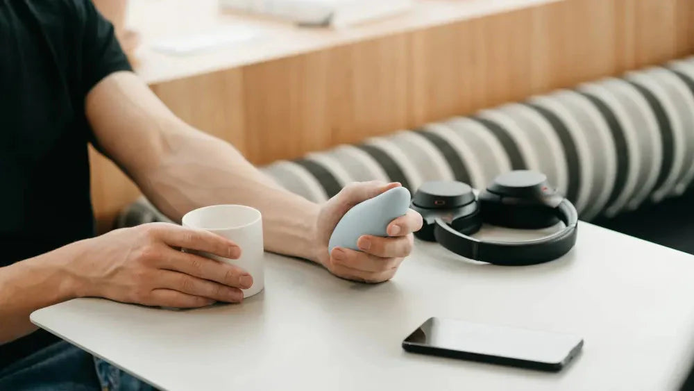 man holding breathwork tool