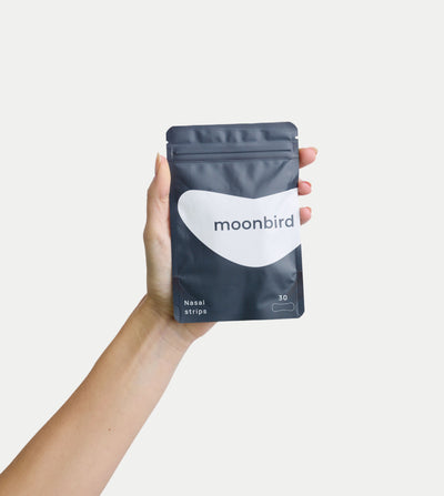 moonbird nasal strips pouch held in a hand
